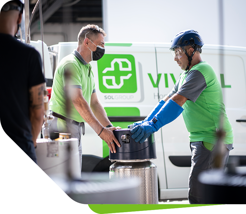An image of a happy woman smiling and sitting in a shopping trolley